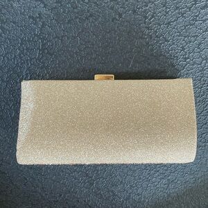 Purse. Never used. Gold and silver. Smoke free home. Can be used as clutch.